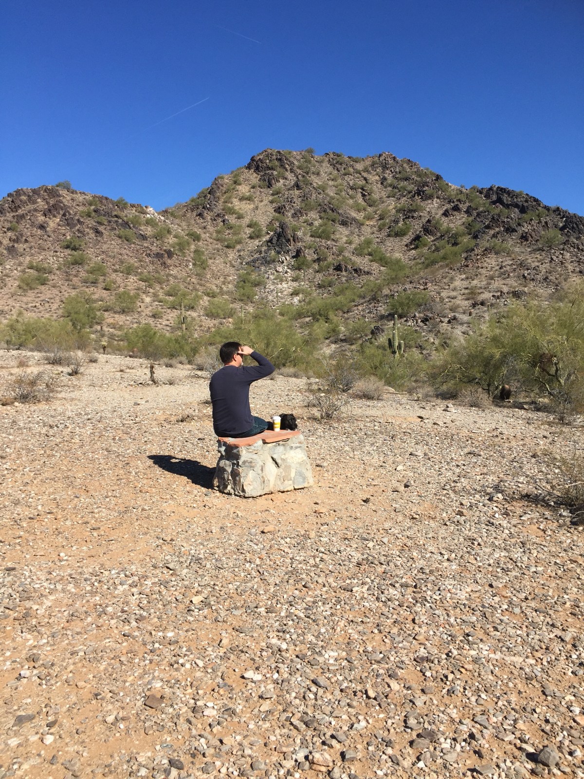 A rock under his bottom